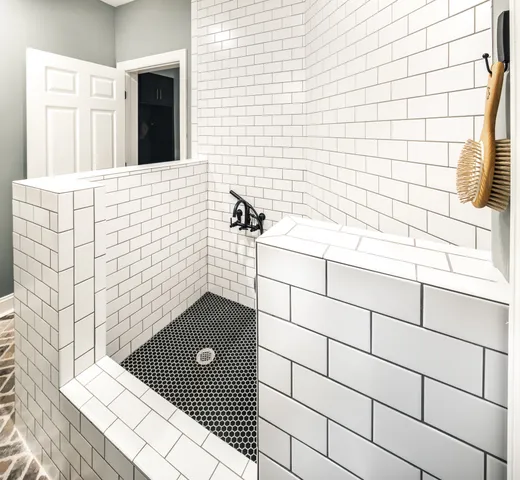 an aerial view of residential house with outdoor space and trees all around