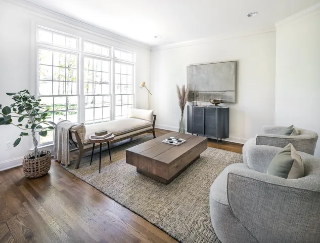 a living room with a flat screen tv and a fireplace