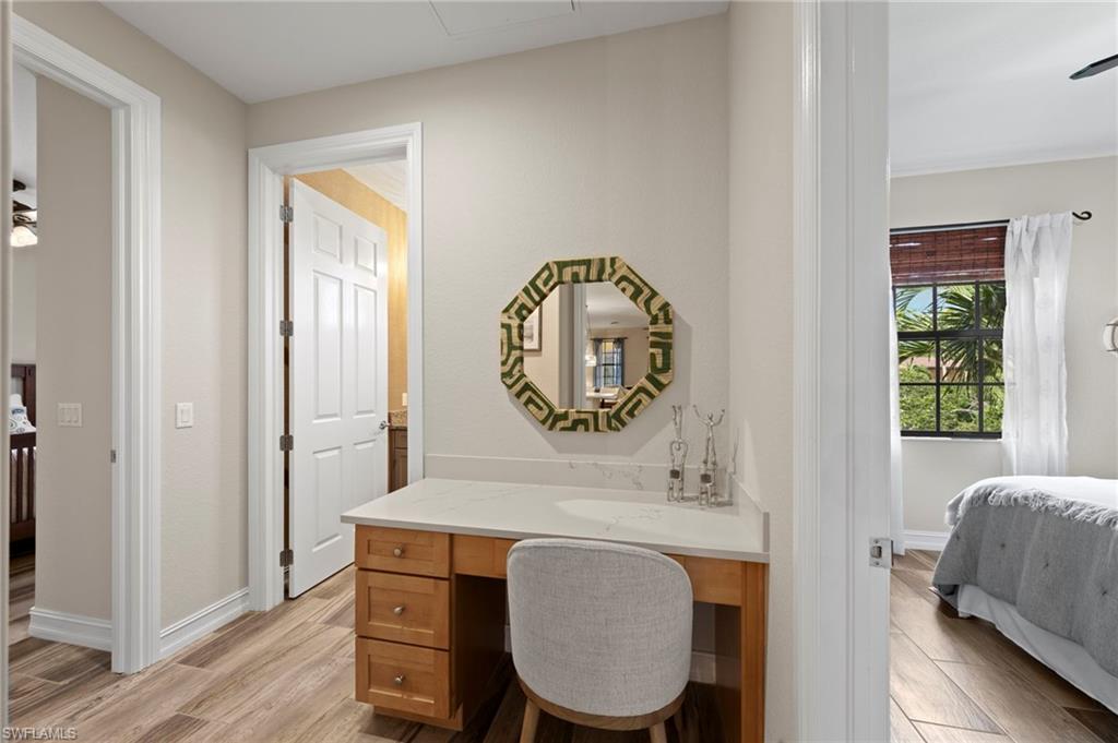 9076 Rialto Street, Unit 6204 Naples, FL 34113 - Photo 24 of 50 A workstation is conveniently located between the secondary bedrooms and can be closed off with a pocket door. NEW QUARTZ COUNTERS (2018), NEW TILE FLOOR (2018)