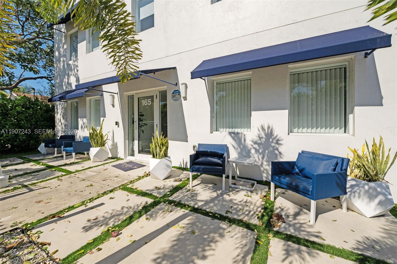 165 Northwest 39th Street, Unit 7 Miami, FL 33127 - Photo 15 of 19 a building outdoor space with patio furniture