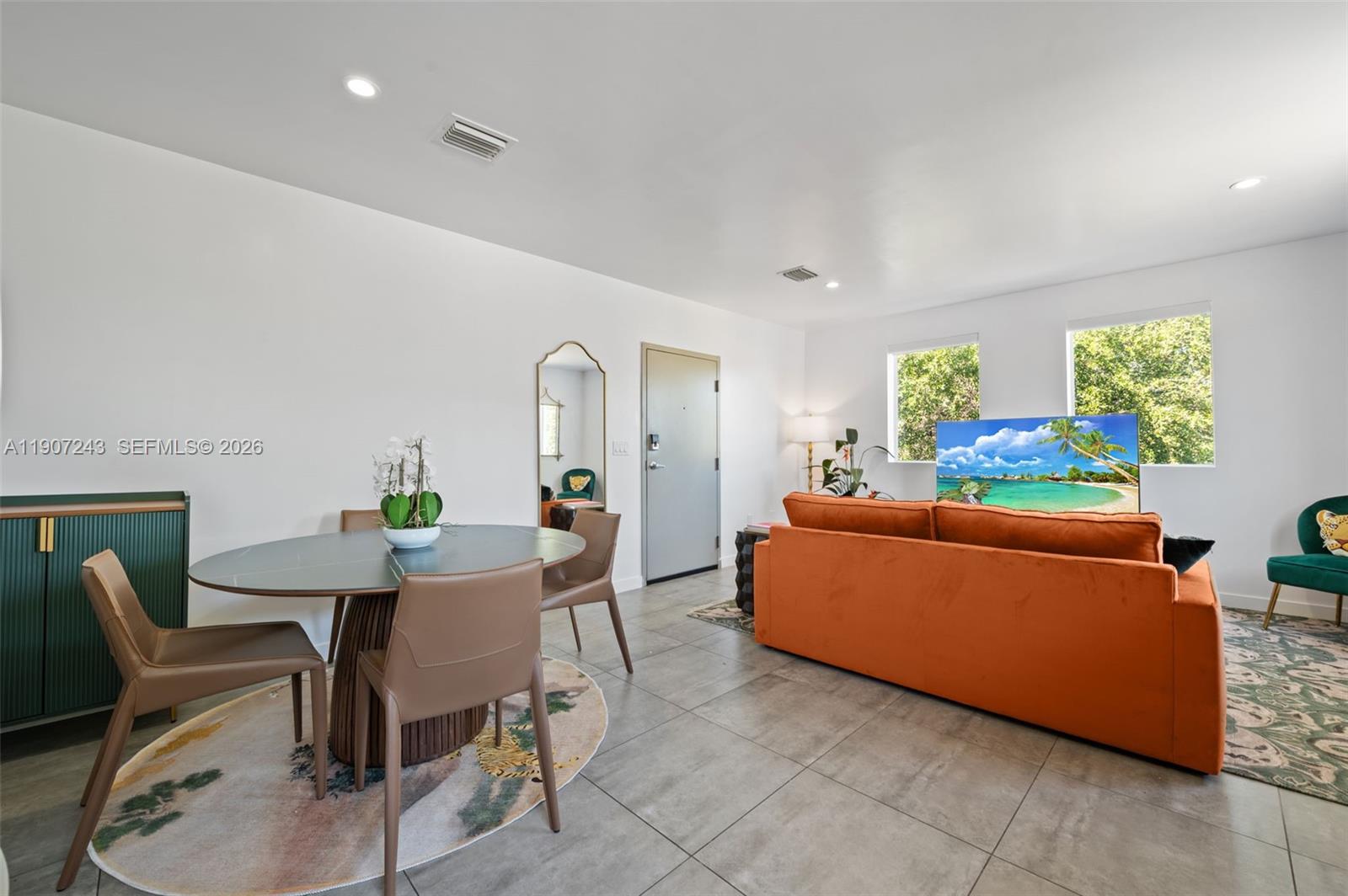 165 Northwest 39th Street, Unit 7 Miami, FL 33127 - Photo 5 of 19 a living room with furniture and wooden floor