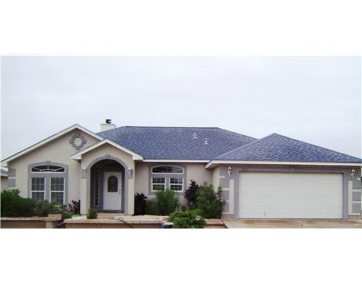 14336 Indigo Street Corpus Christi, TX 78418 - Photo 2 of 2 a front view of a house with a yard