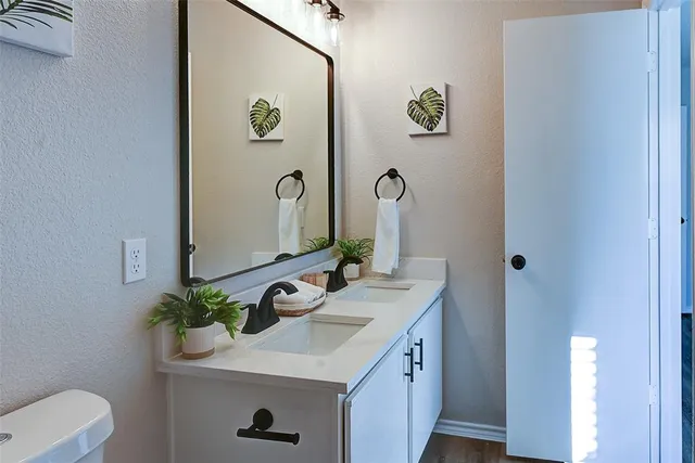 a bathroom with a sink a vanity and a mirror