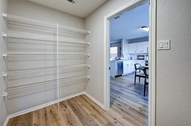 a view of livingroom with hardwood floor and a ceiling fan