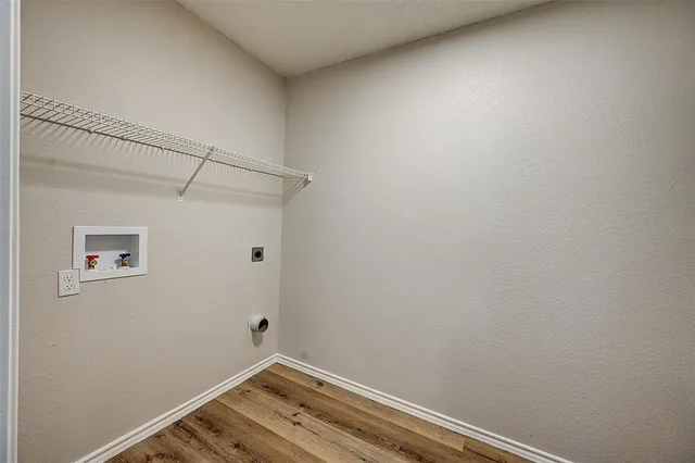 a view of small space with empty racks on the wall