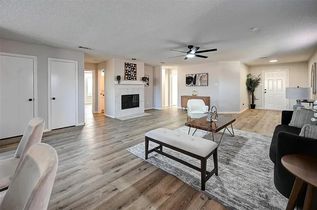 a living room with furniture and a fireplace