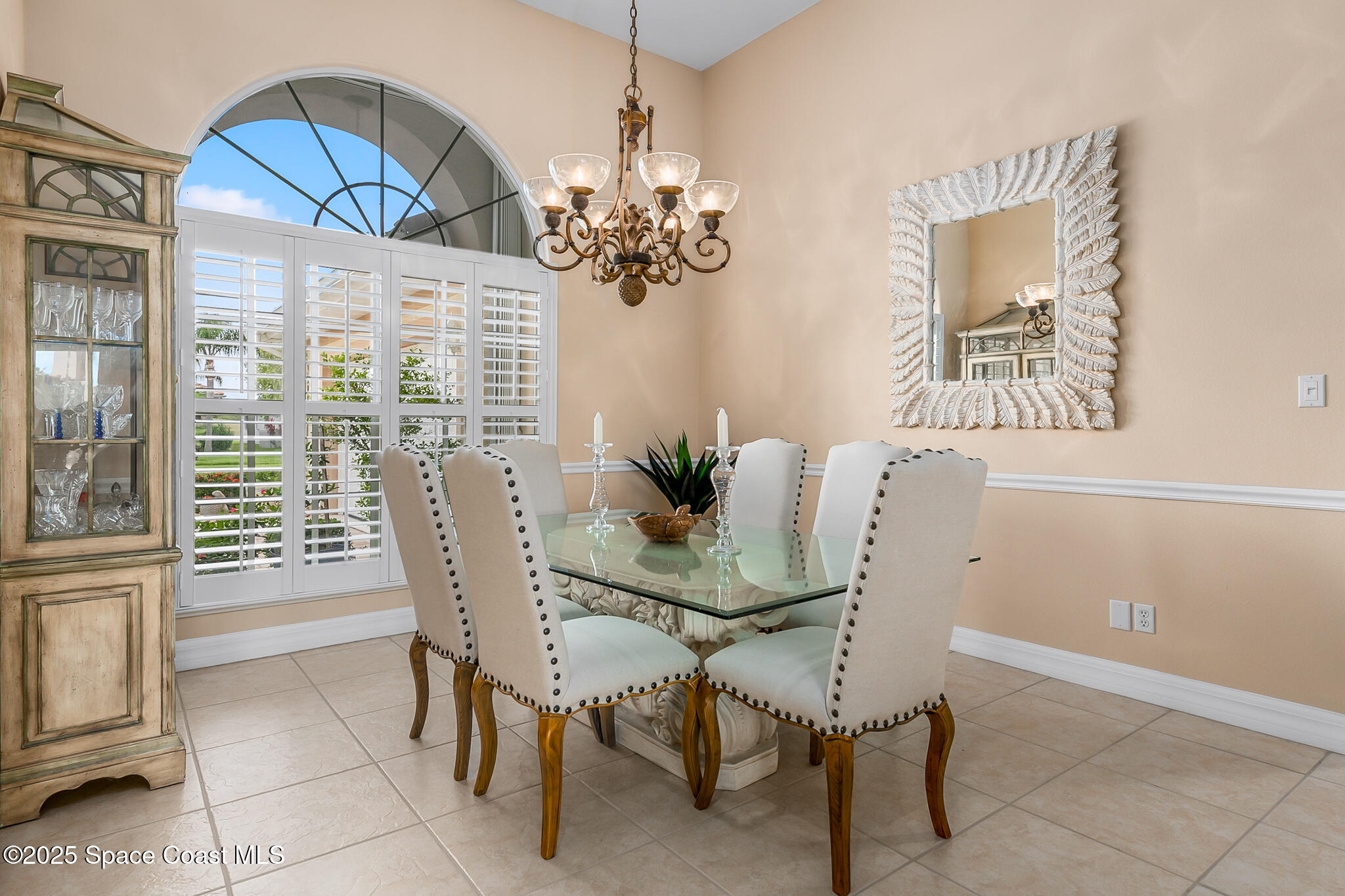 4336 Collingtree Drive Rockledge, FL 32955 - Photo 14 of 62 a view of a dining room with furniture and a chandelier