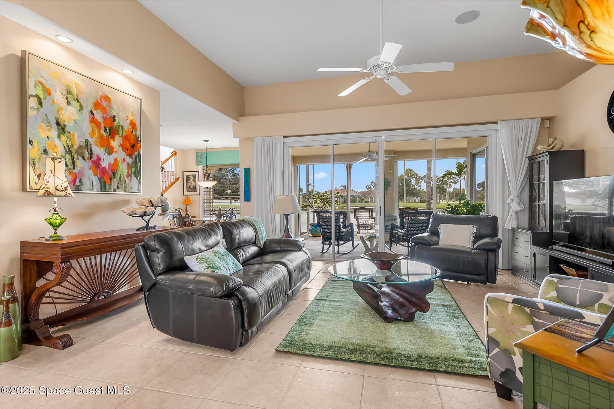 4336 Collingtree Drive Rockledge, FL 32955 - Photo 19 of 62 a living room with furniture a rug and a flat screen tv