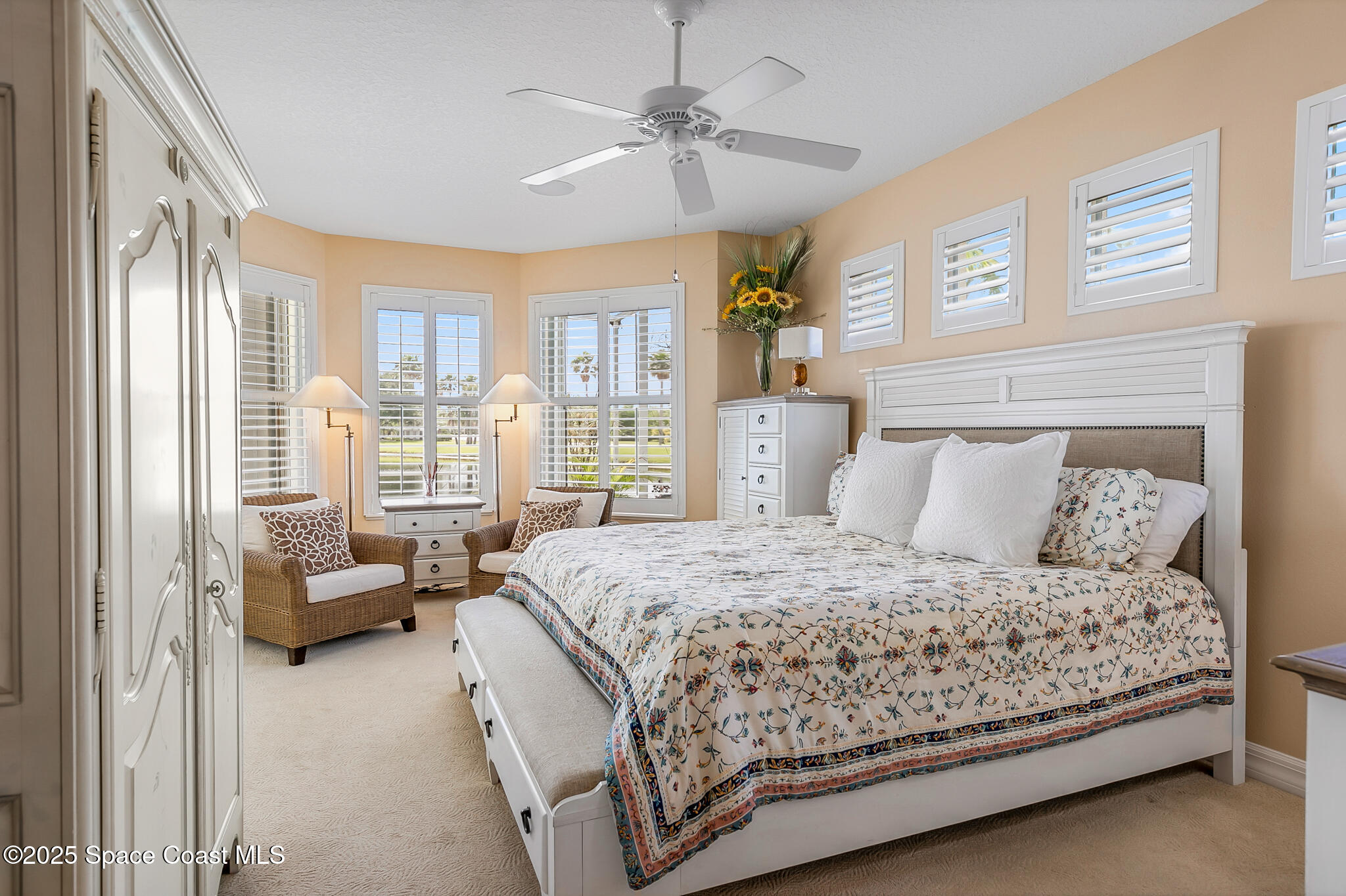 4336 Collingtree Drive Rockledge, FL 32955 - Photo 22 of 62 a bedroom with a bed and a chandelier