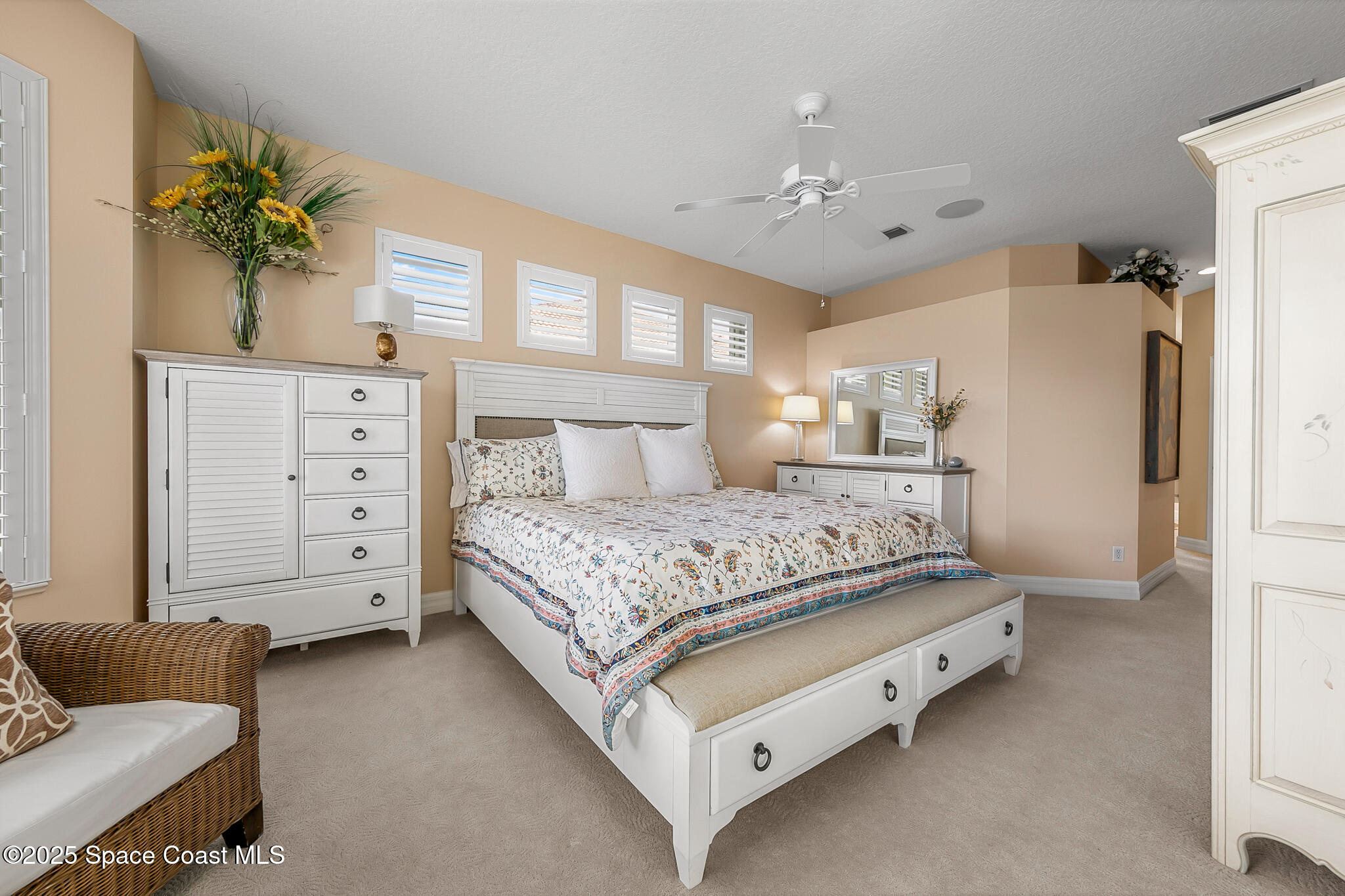 4336 Collingtree Drive Rockledge, FL 32955 - Photo 23 of 62 a bedroom with a large bed and a couch