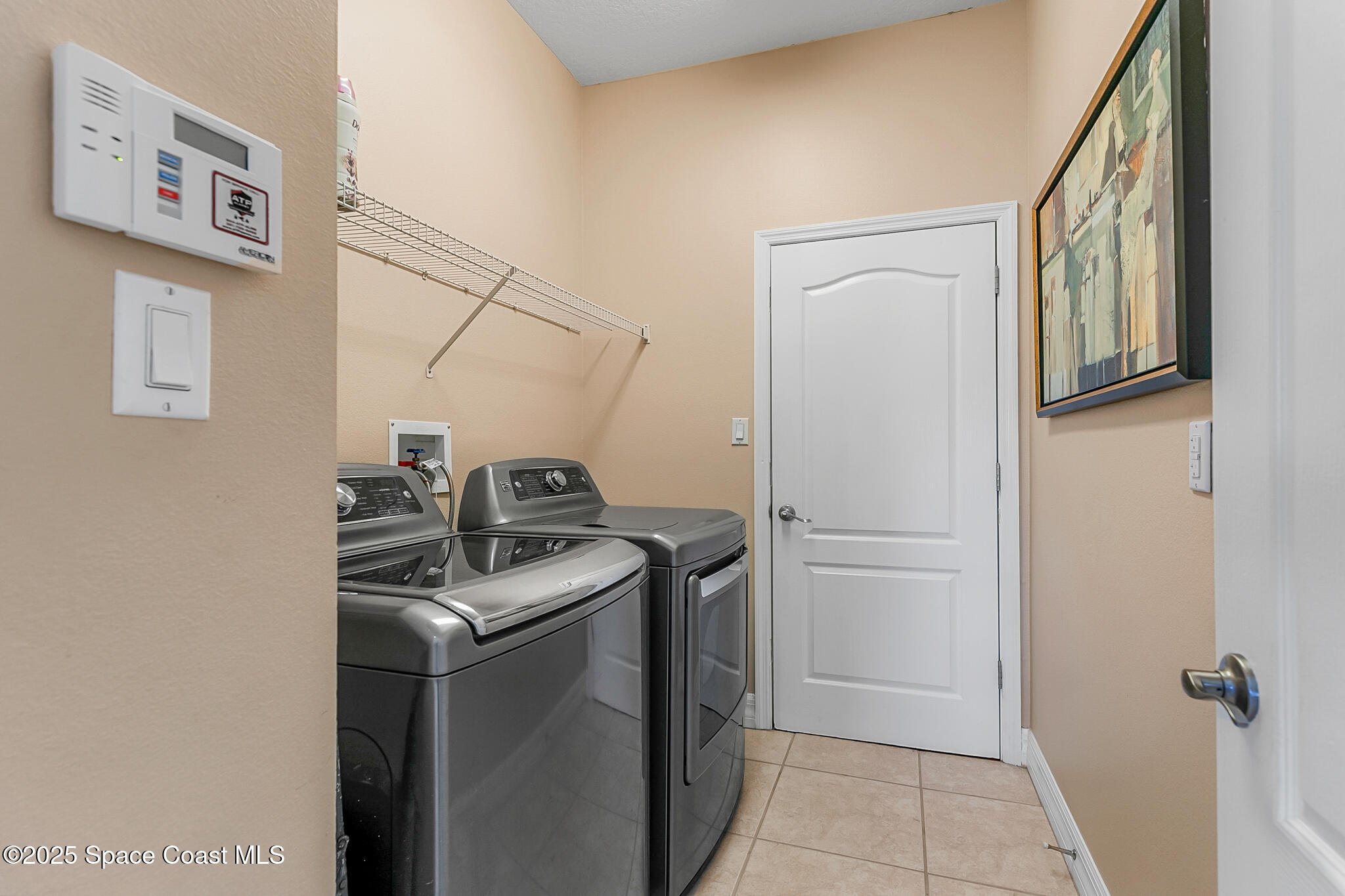 4336 Collingtree Drive Rockledge, FL 32955 - Photo 30 of 62 a utility room with dryer and washer