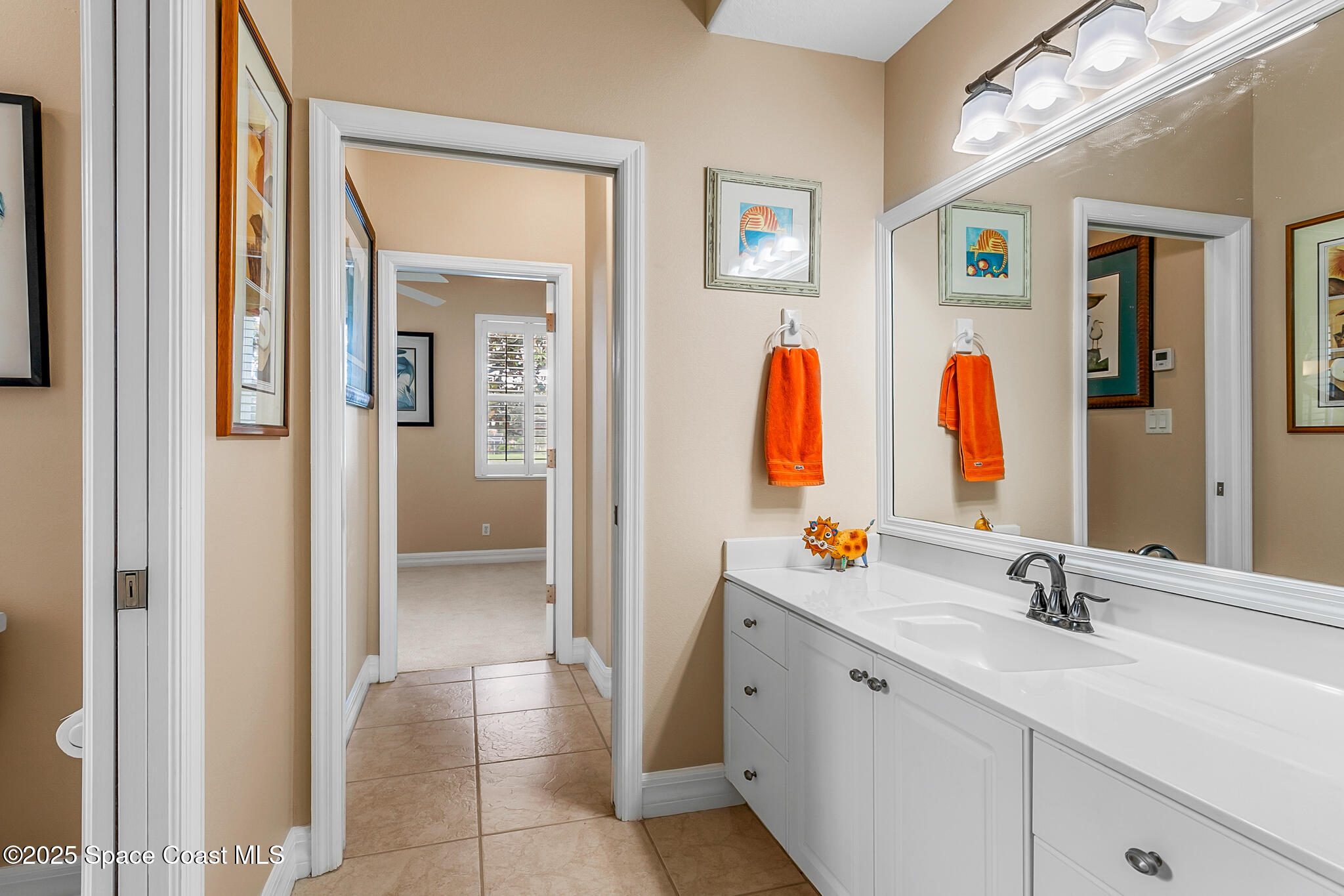4336 Collingtree Drive Rockledge, FL 32955 - Photo 32 of 62 a bathroom with a double vanity sink and a mirror