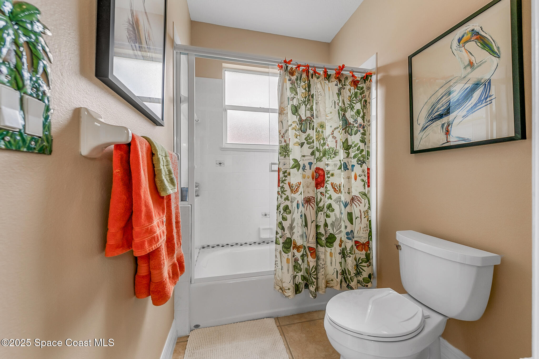 4336 Collingtree Drive Rockledge, FL 32955 - Photo 33 of 62 a bathroom with a toilet and a shower curtain