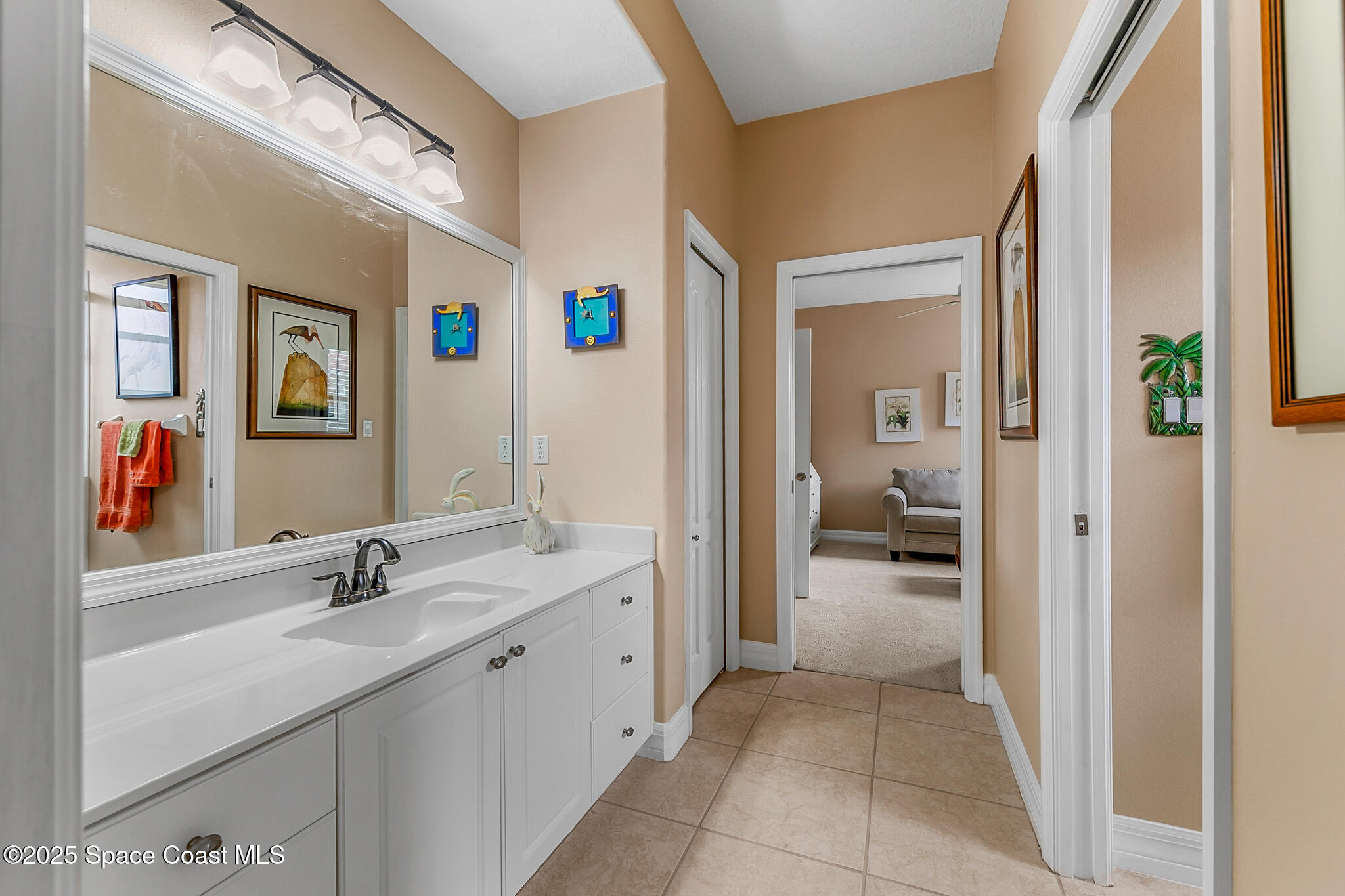 4336 Collingtree Drive Rockledge, FL 32955 - Photo 34 of 62 a en suite bathroom with a sink and a mirror