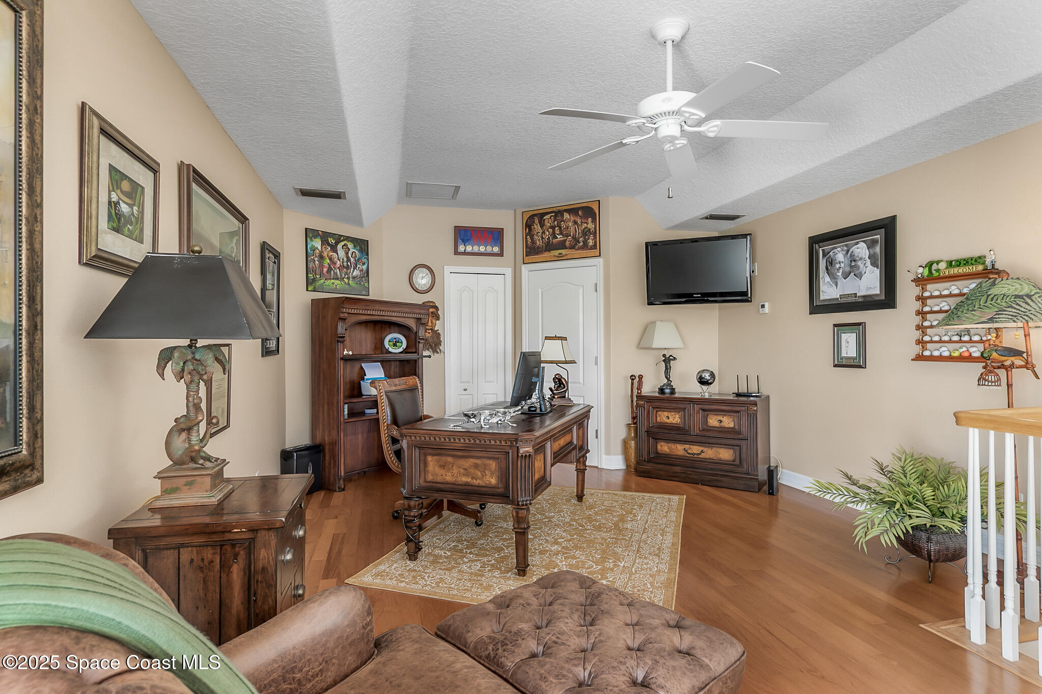 4336 Collingtree Drive Rockledge, FL 32955 - Photo 42 of 62 a living room with furniture a rug and a flat screen tv
