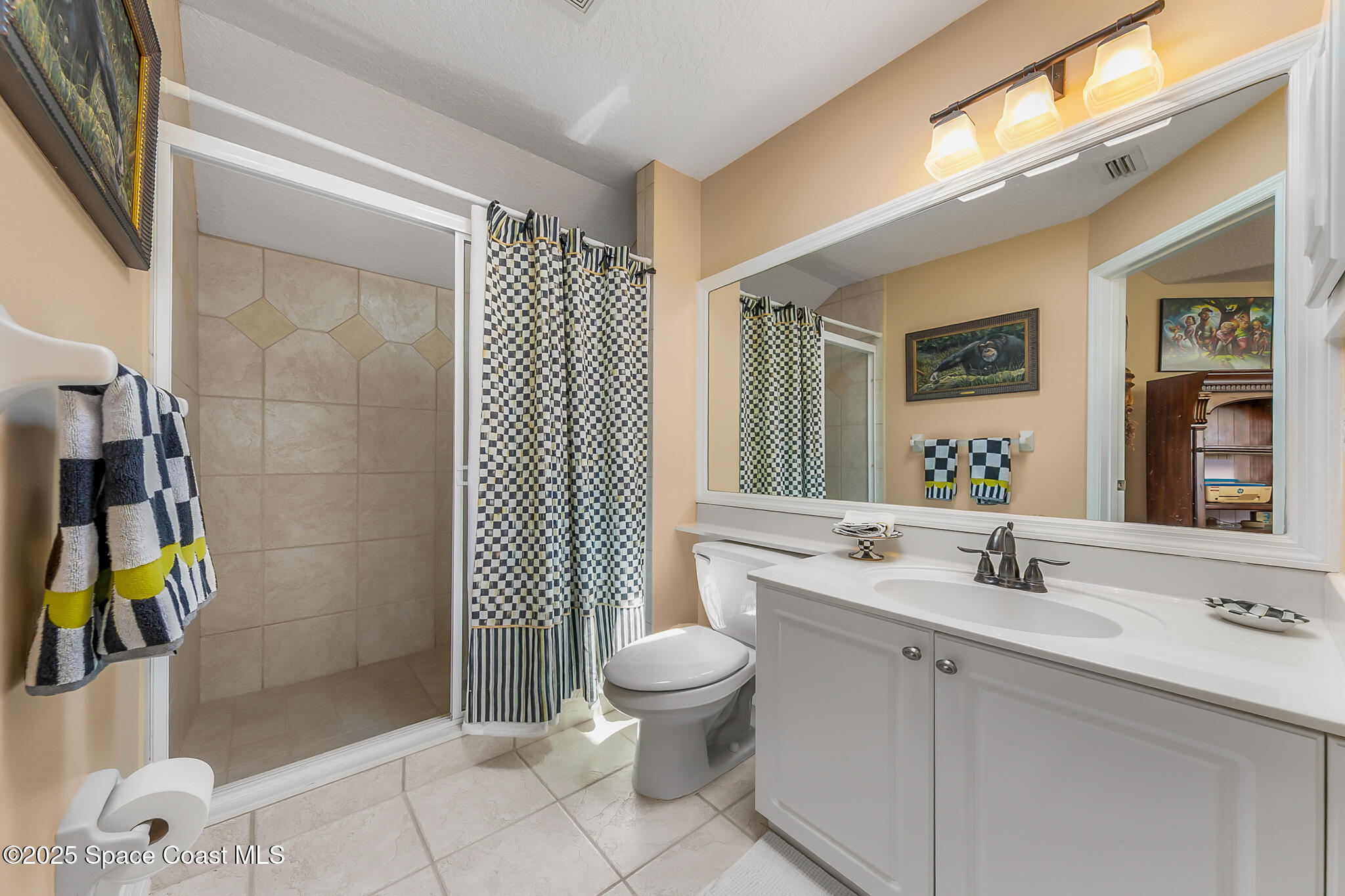 4336 Collingtree Drive Rockledge, FL 32955 - Photo 44 of 62 a bathroom with a sink toilet and shower