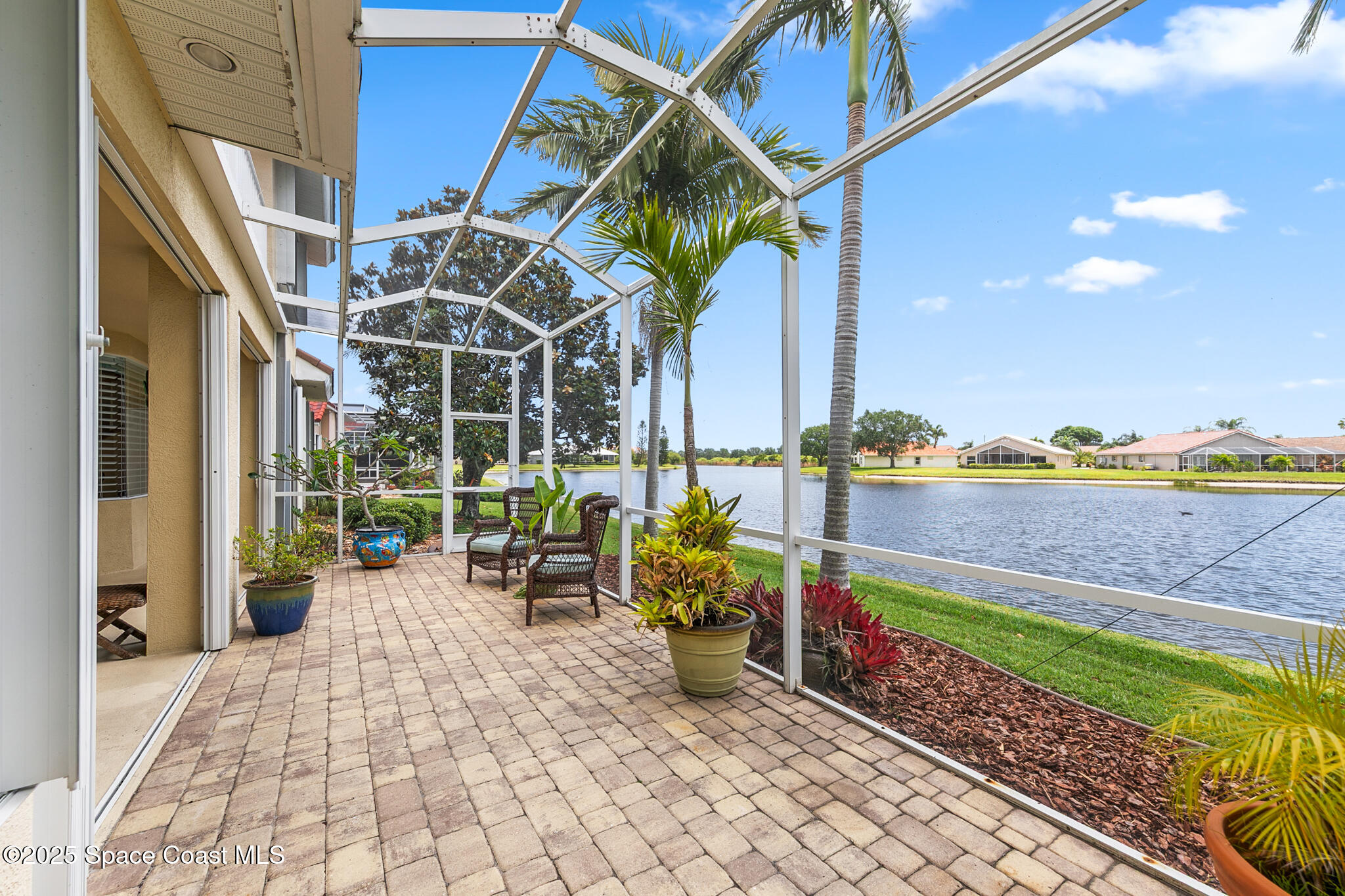 4336 Collingtree Drive Rockledge, FL 32955 - Photo 48 of 62 a view of a chairs and table in patio with wooden fence