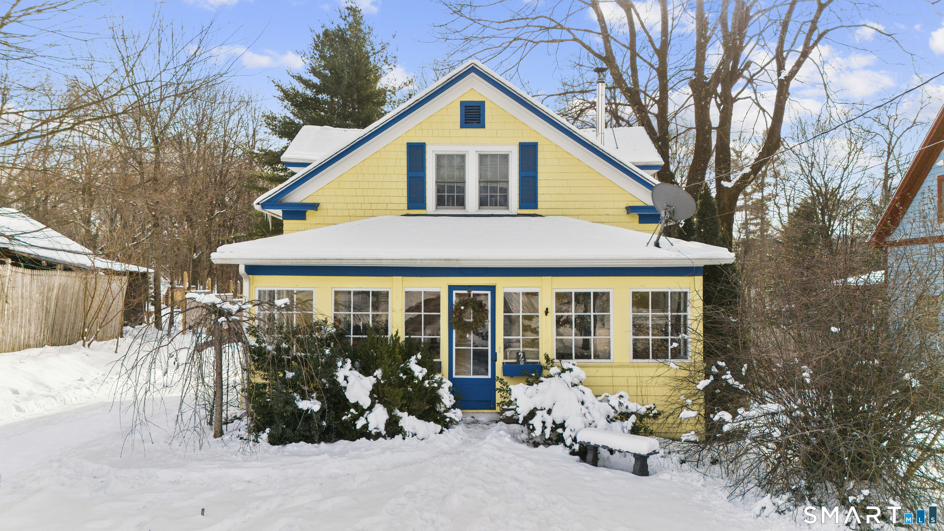 a front view of a house with a yard outdoor seating and terrace