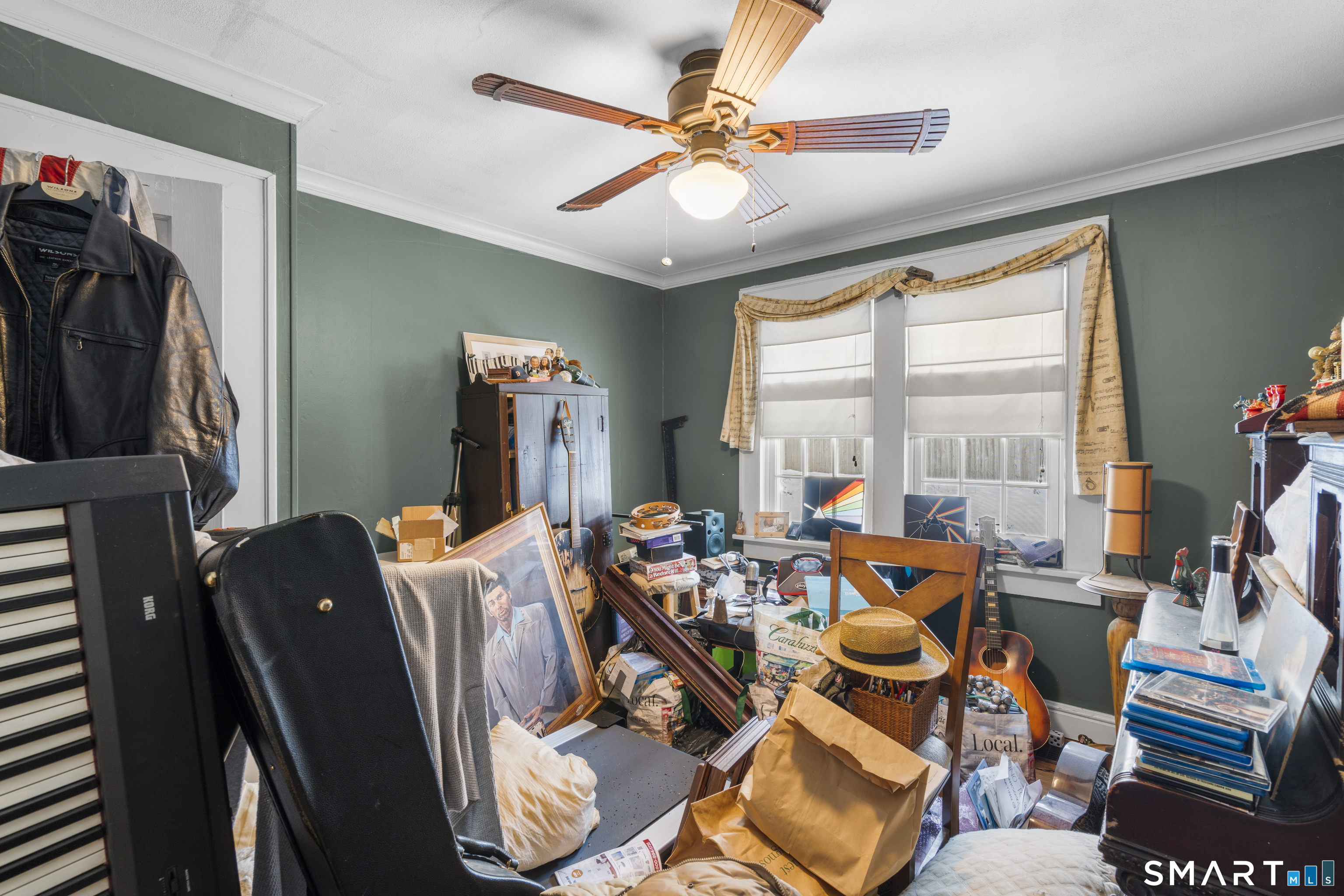 28 Reservoir Street Bethel, CT 06801 - Photo 12 of 40 a living room with furniture and a large window