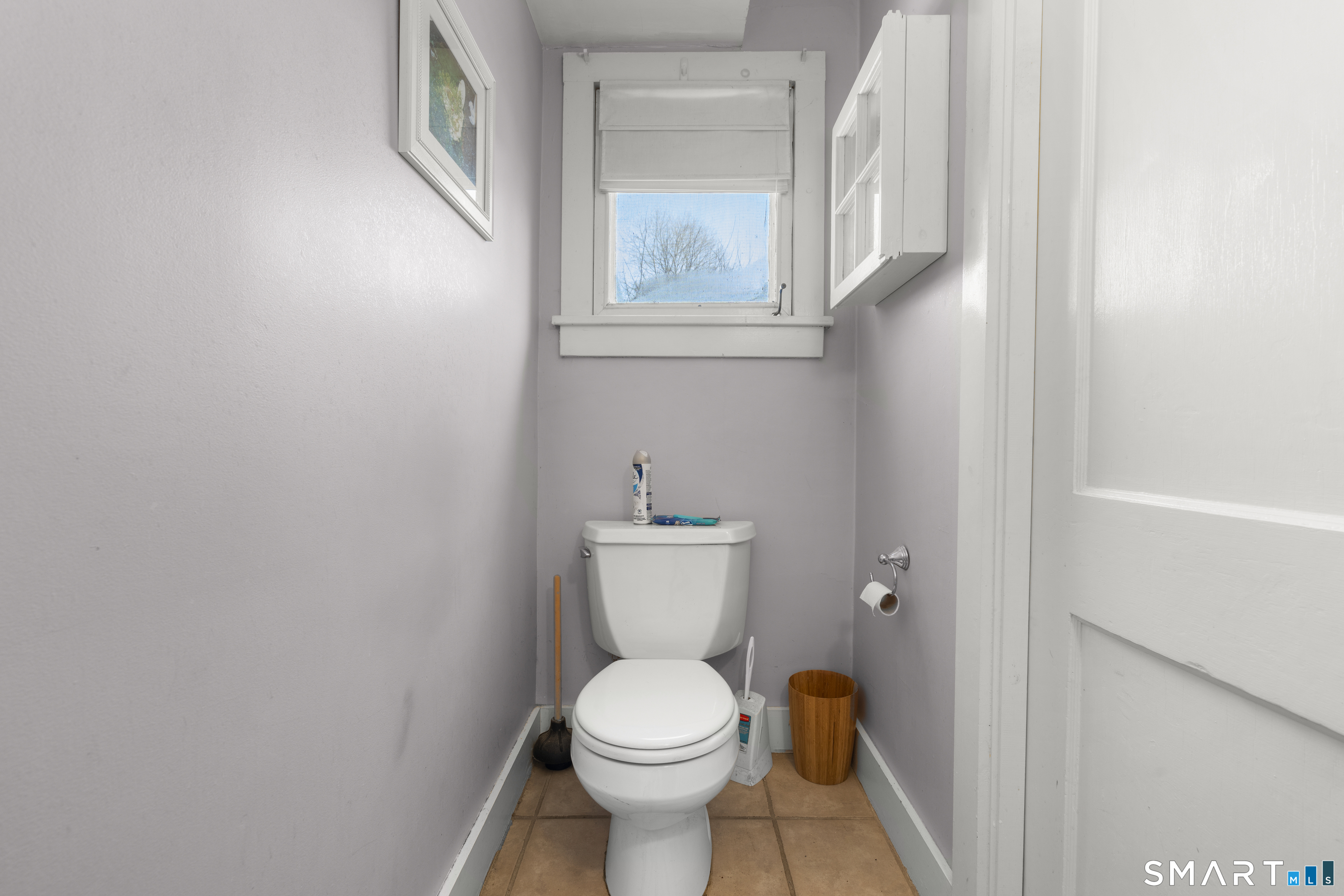 28 Reservoir Street Bethel, CT 06801 - Photo 13 of 40 a white toilet sitting next to a white sink and vanity