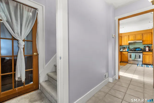 a view of a living room with a fireplace