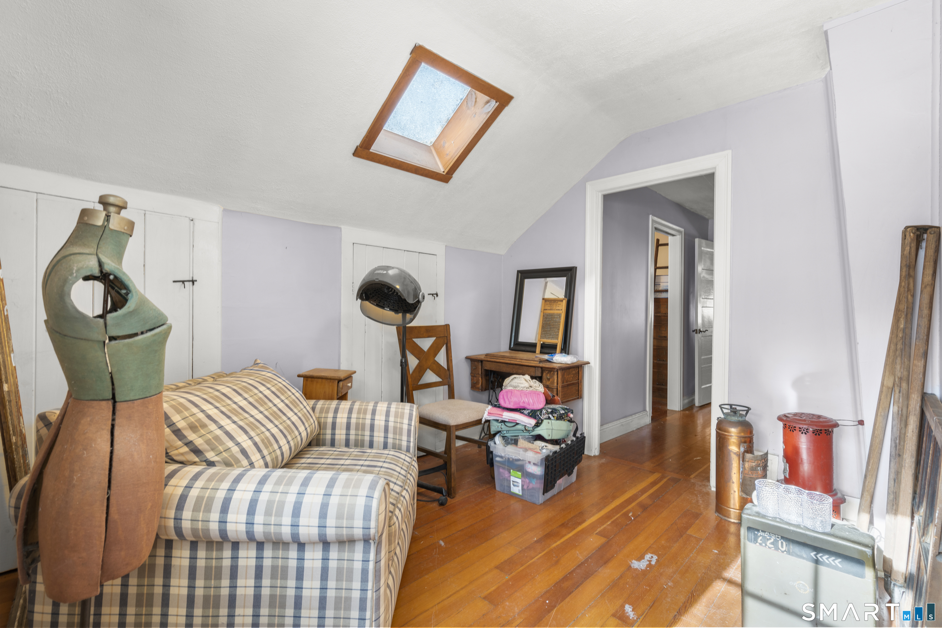 28 Reservoir Street Bethel, CT 06801 - Photo 16 of 40 a bedroom with furniture and a wooden floor