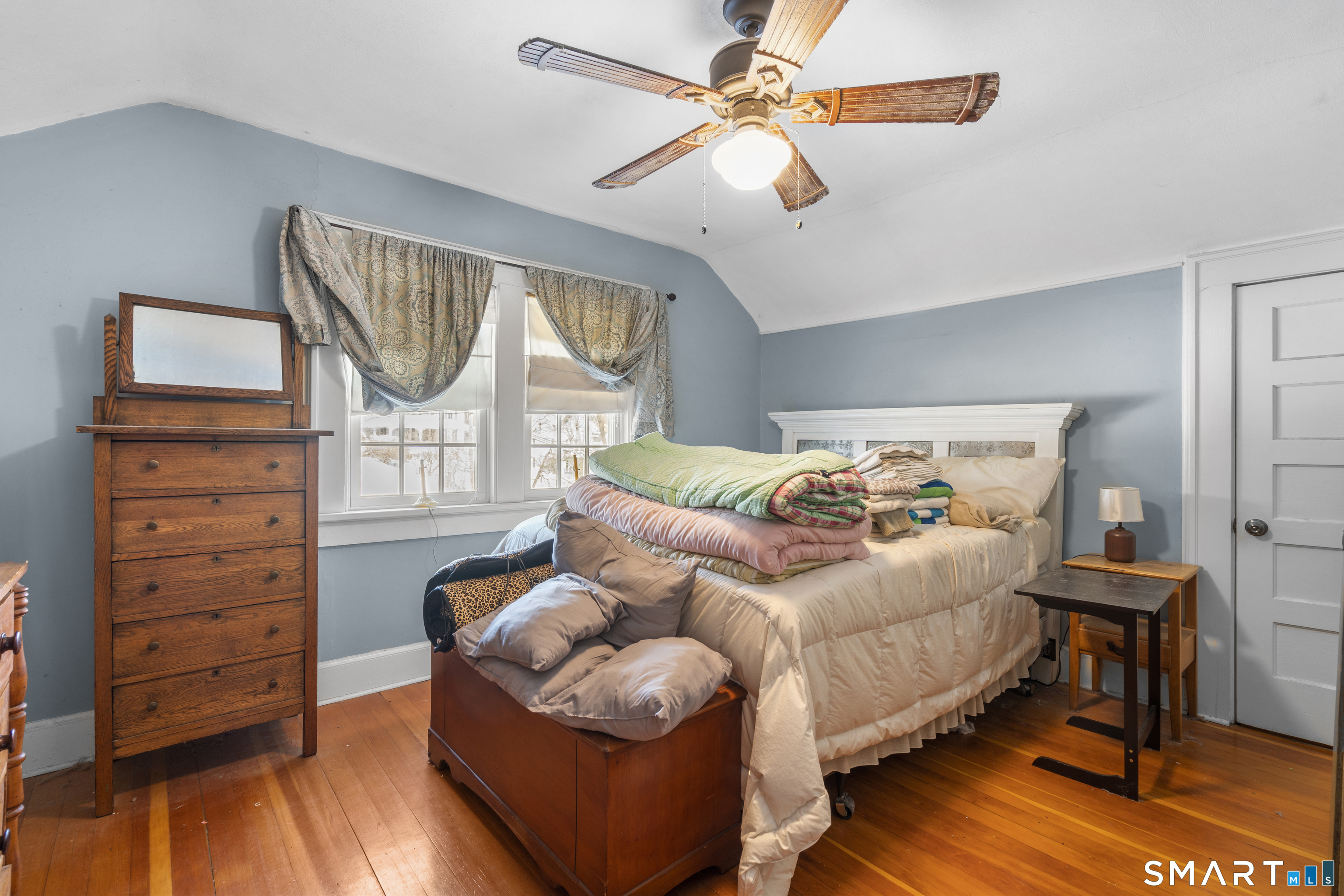 28 Reservoir Street Bethel, CT 06801 - Photo 18 of 40 a bedroom with a bed and a chandelier