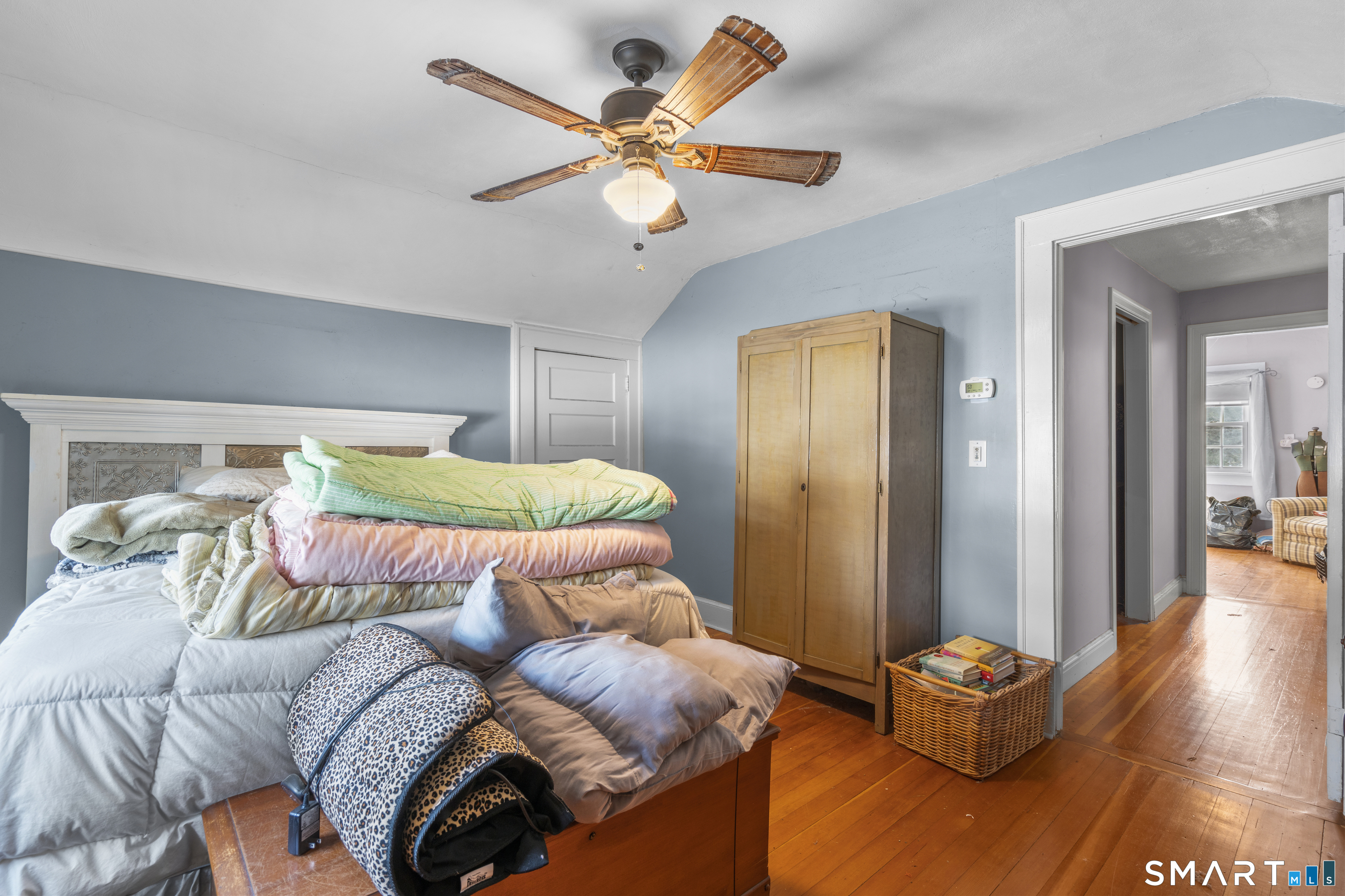 28 Reservoir Street Bethel, CT 06801 - Photo 19 of 40 a bedroom with a bed and wooden floor