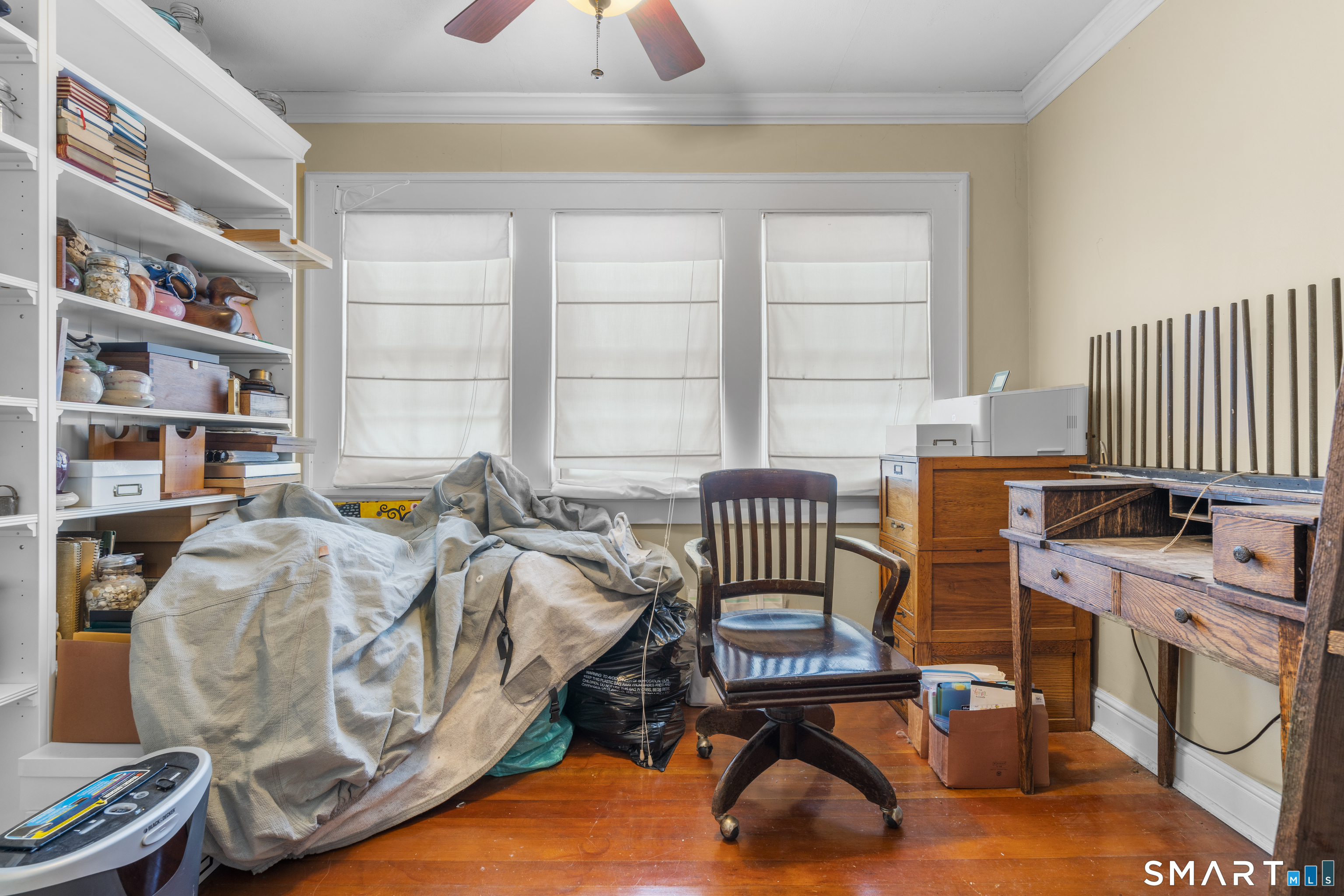 28 Reservoir Street Bethel, CT 06801 - Photo 21 of 40 a bedroom with furniture and a book shelf