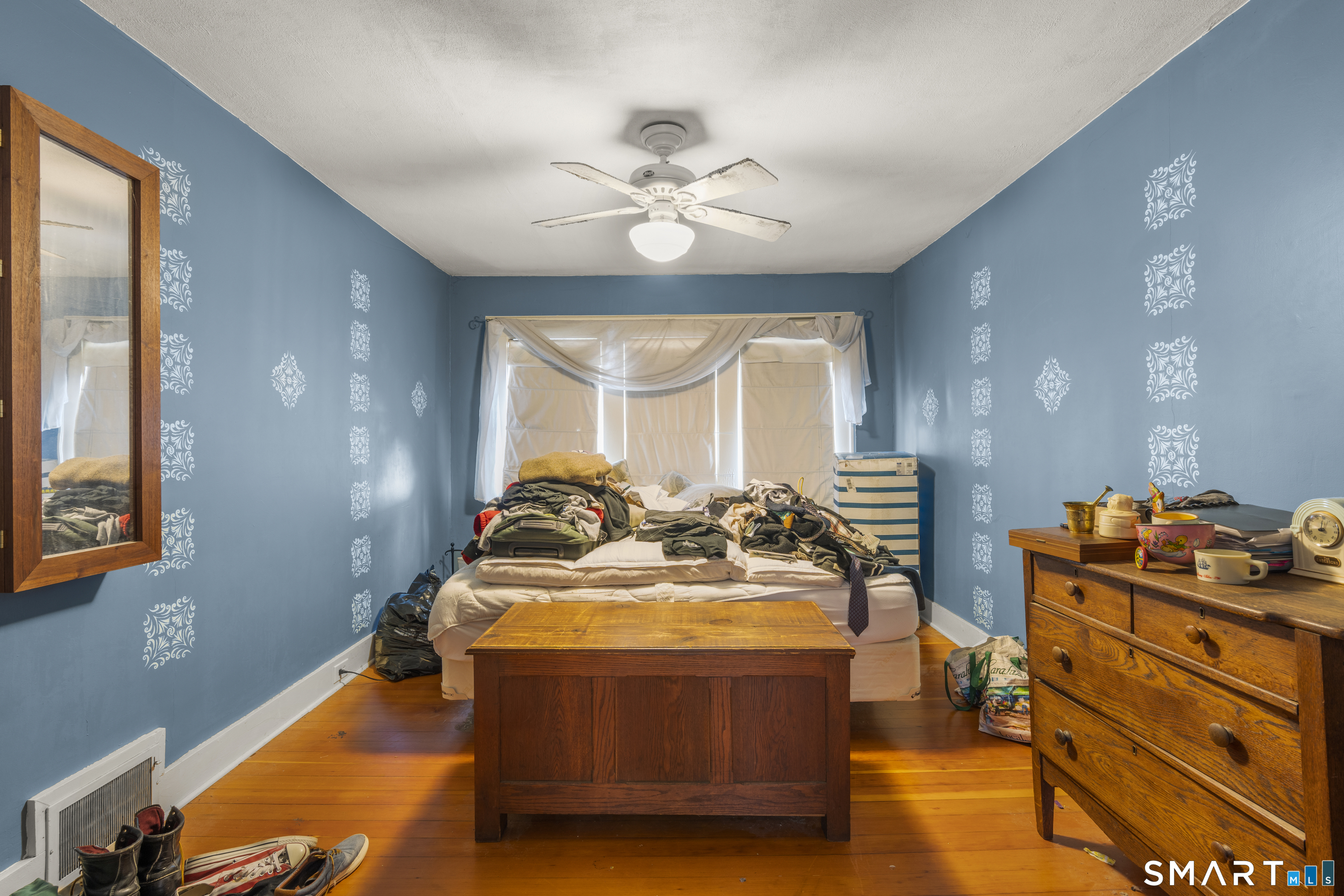 28 Reservoir Street Bethel, CT 06801 - Photo 23 of 40 a living room with fireplace furniture and a chandelier
