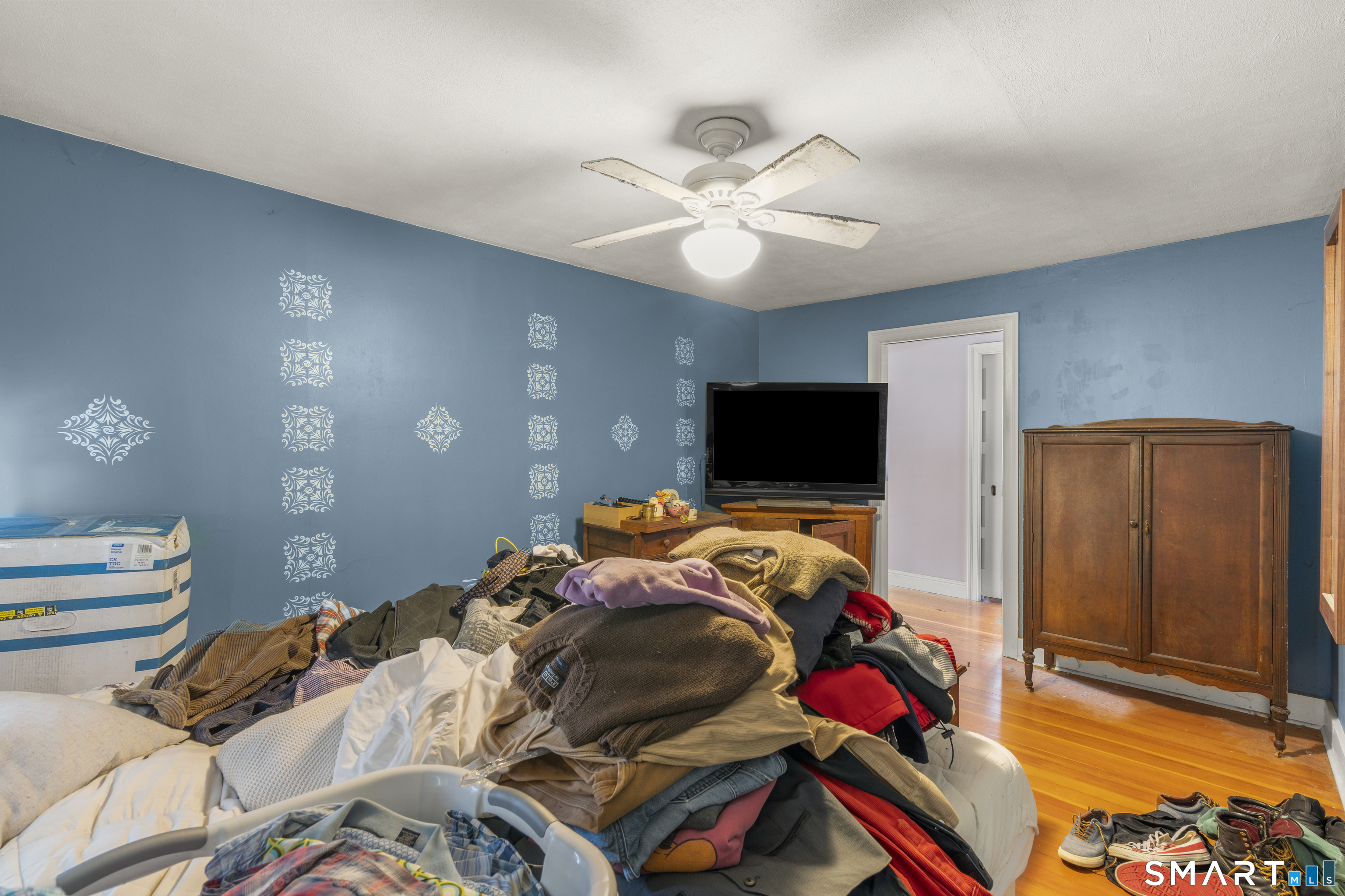 28 Reservoir Street Bethel, CT 06801 - Photo 24 of 40 a bedroom with a bed and a flat screen tv