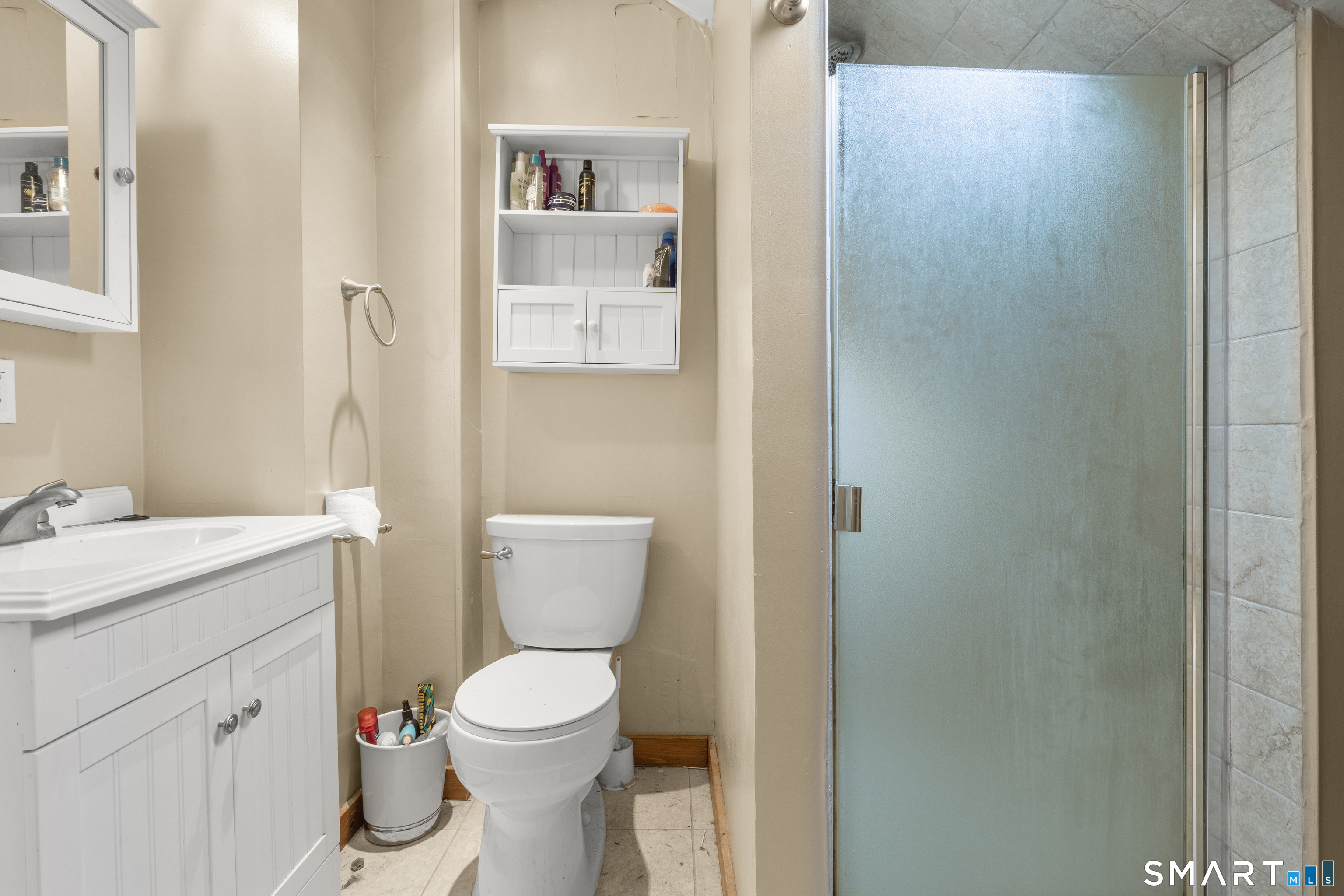 28 Reservoir Street Bethel, CT 06801 - Photo 26 of 40 a white toilet sitting next to a bathroom sink