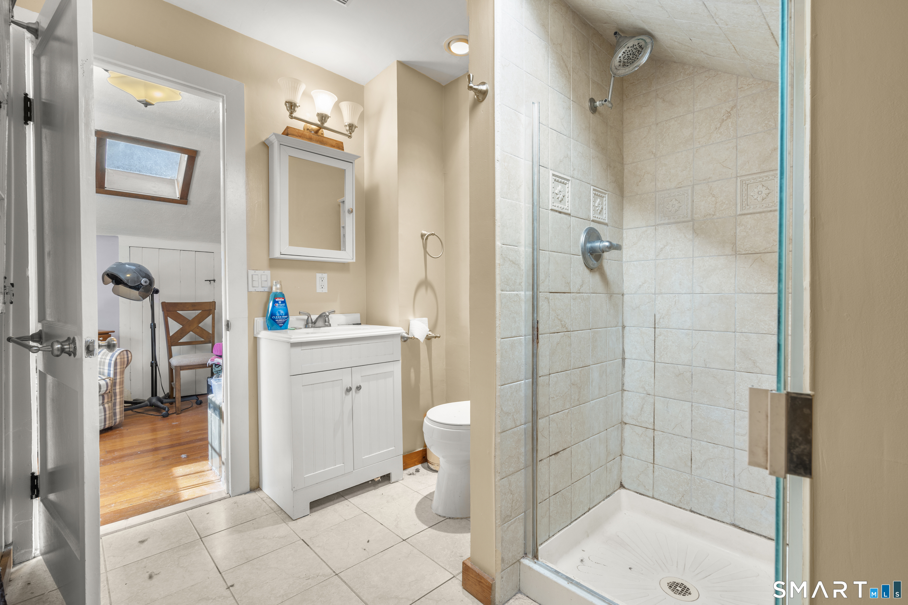 28 Reservoir Street Bethel, CT 06801 - Photo 27 of 40 a bathroom with a sink a toilet and shower