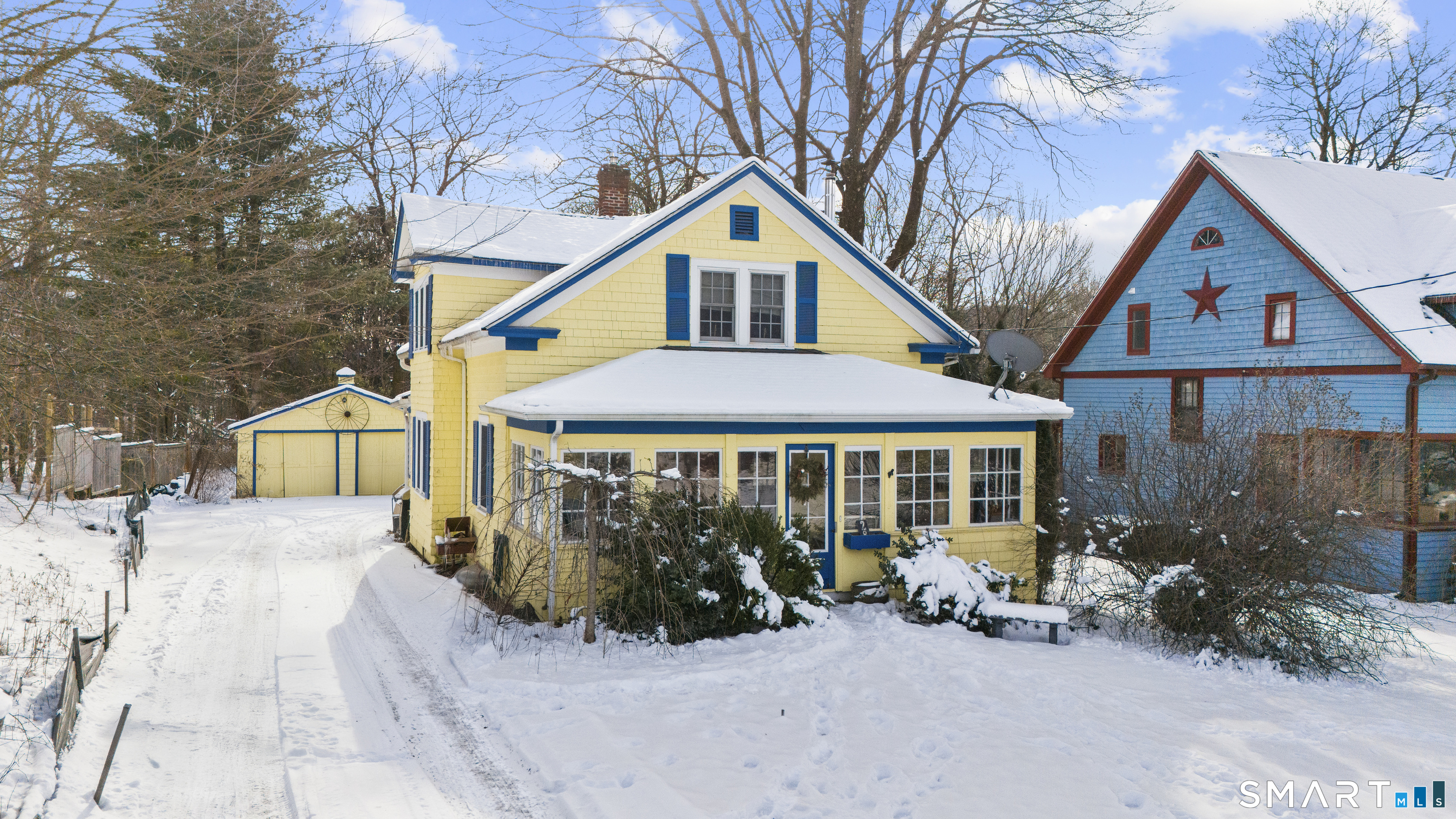 28 Reservoir Street Bethel, CT 06801 - Photo 3 of 40 a view of a house with a yard and large trees