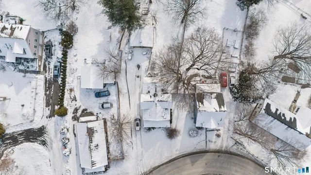 a view of a house with yard and sitting area