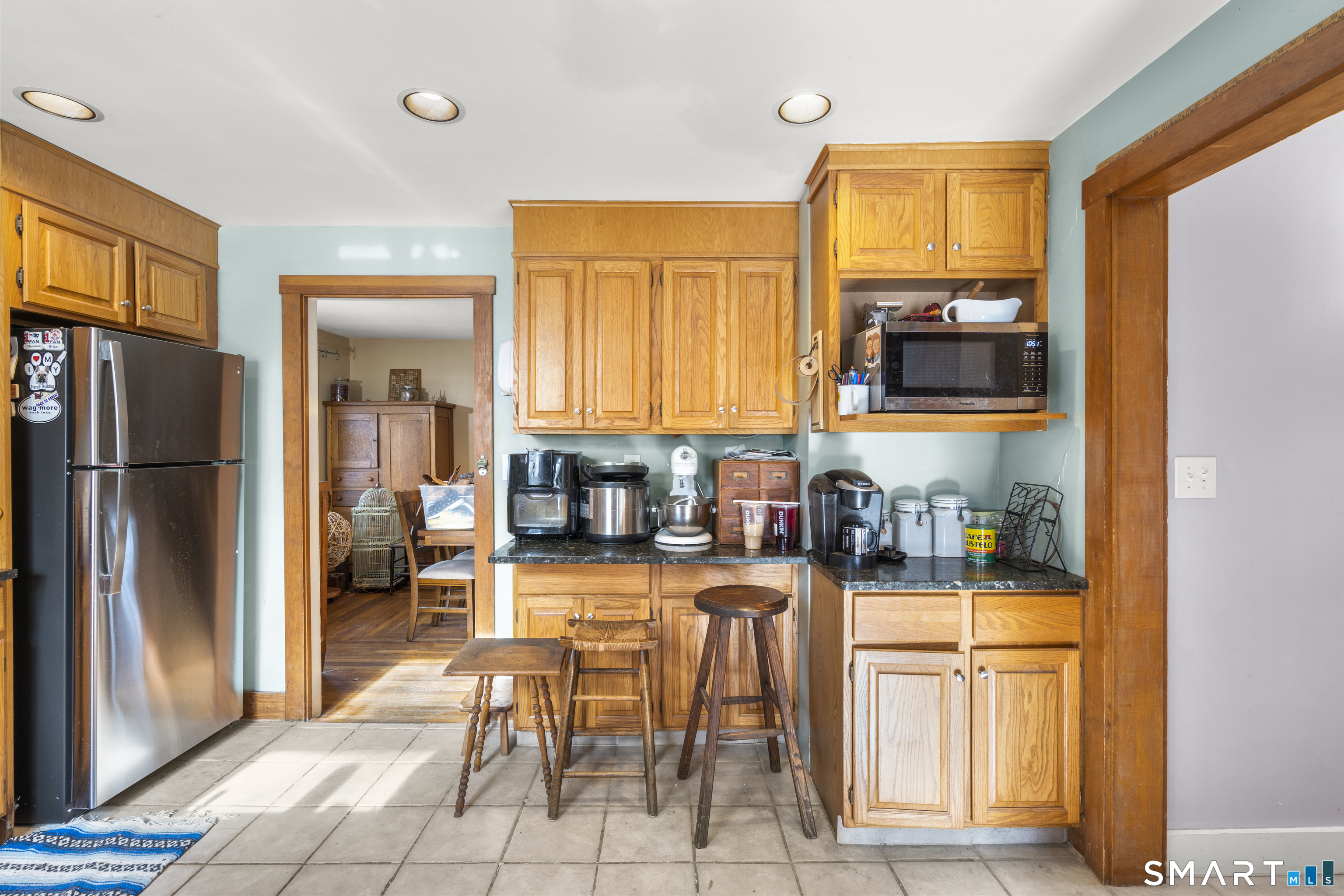 28 Reservoir Street Bethel, CT 06801 - Photo 6 of 40 a kitchen with stainless steel appliances granite countertop a refrigerator and a stove top oven
