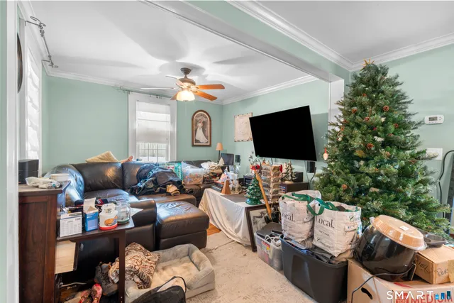 a outdoor living space with furniture and a flat screen tv