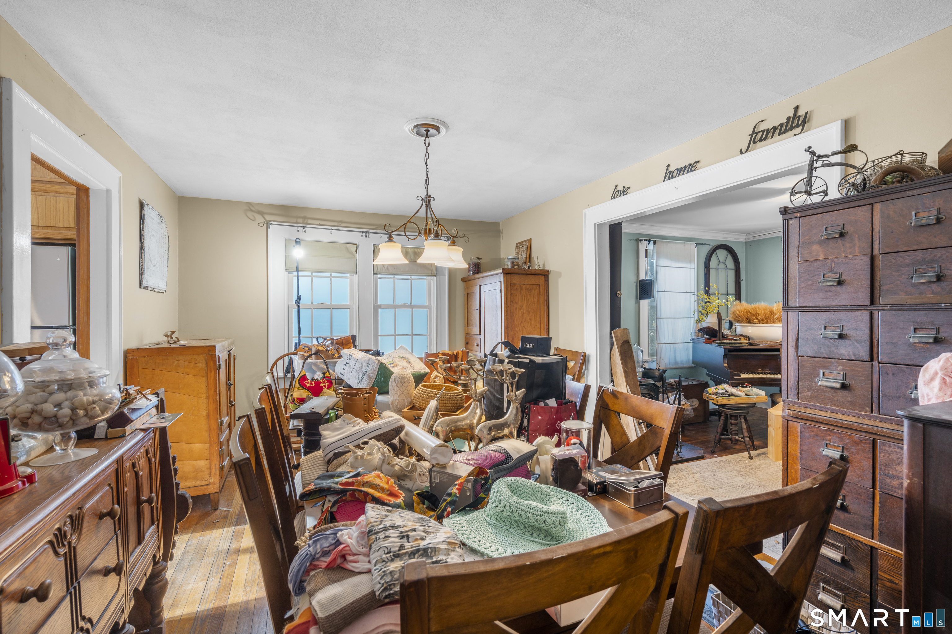 28 Reservoir Street Bethel, CT 06801 - Photo 10 of 40 a view of a dining room with furniture and chandelier