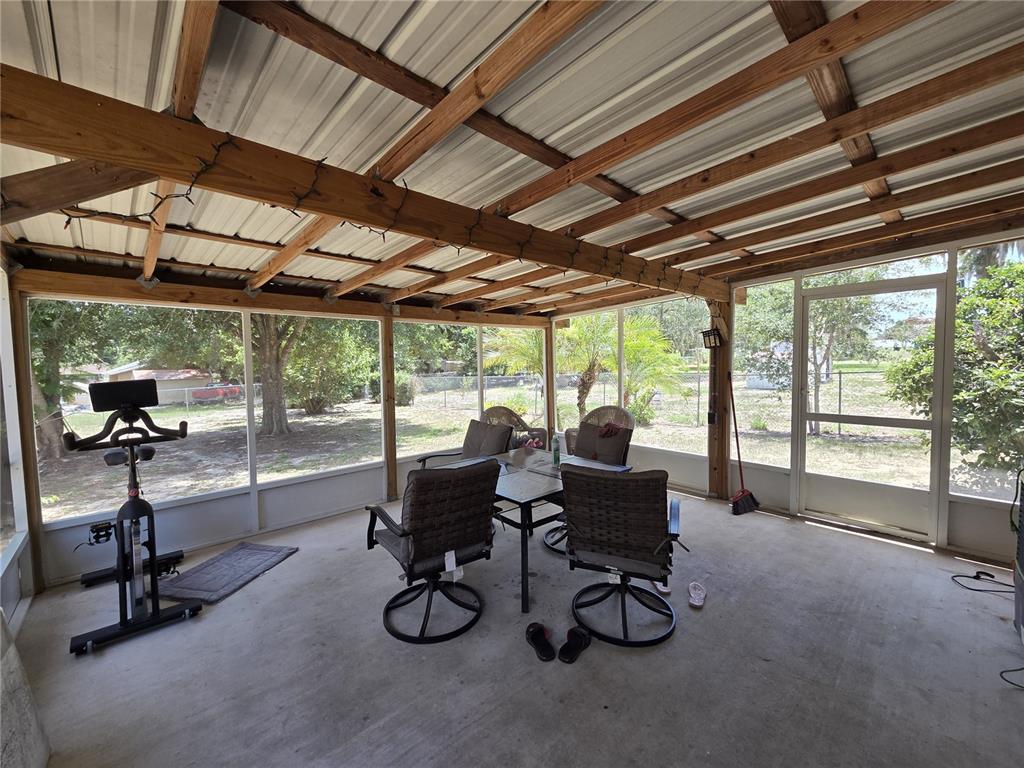 124 East F Street Frostproof, FL 33843 - Photo 29 of 37 a view of a livingroom with furniture wooden floor and windows