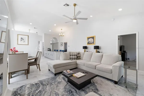 a view of a dining room with furniture and window