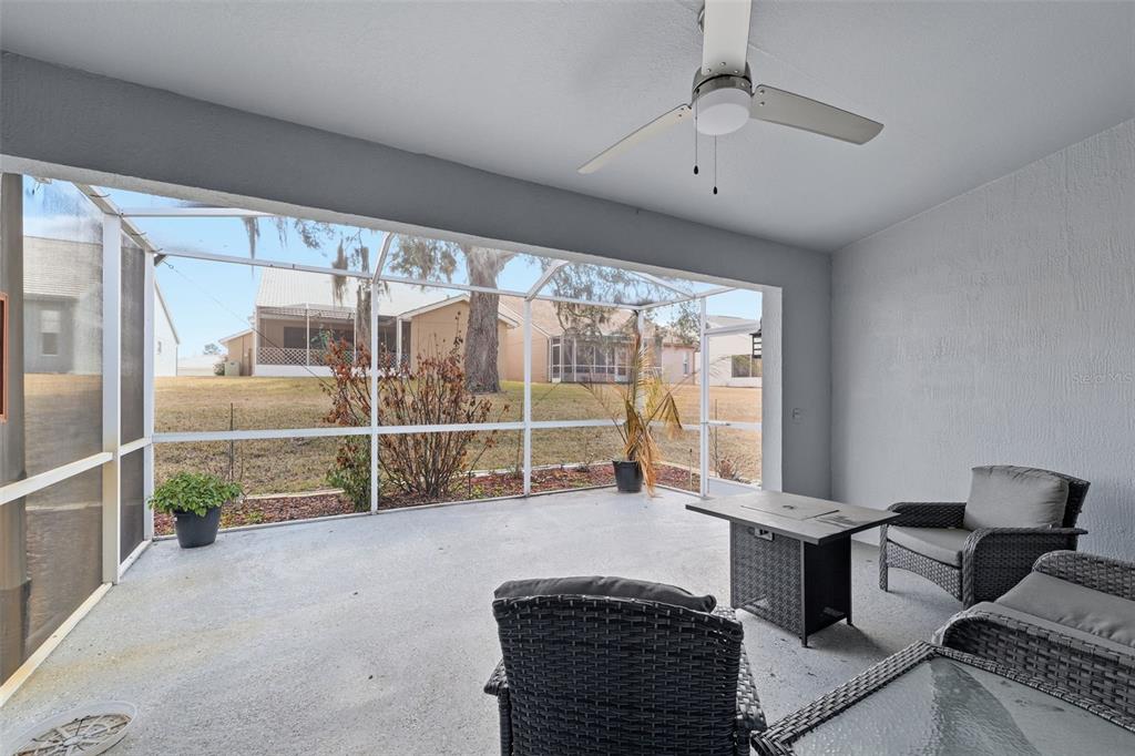 9376 French Quarters Circle Weeki Wachee, FL 34613 - Photo 18 of 43 a room with furniture and a large window