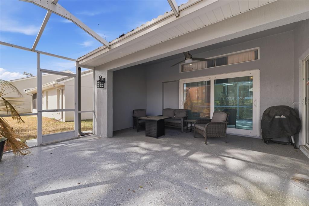 9376 French Quarters Circle Weeki Wachee, FL 34613 - Photo 19 of 43 a living room with furniture and a fireplace