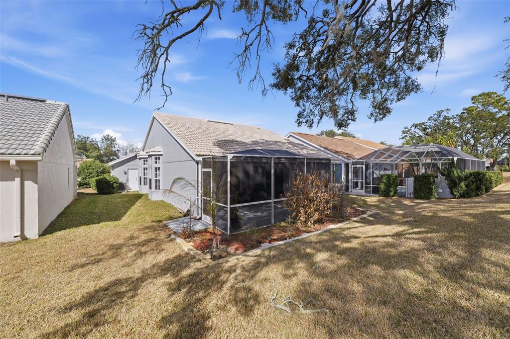 9376 French Quarters Circle Weeki Wachee, FL 34613 - Photo 21 of 43 a view of a house with a yard