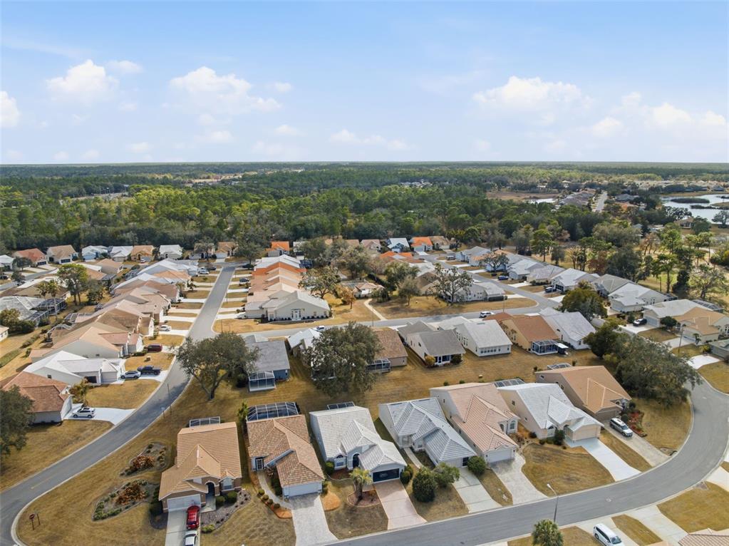 9376 French Quarters Circle Weeki Wachee, FL 34613 - Photo 31 of 43 an aerial view of a city with lots of residential buildings