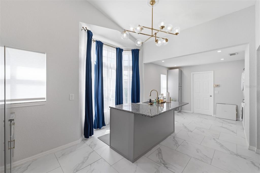 9376 French Quarters Circle Weeki Wachee, FL 34613 - Photo 38 of 43 a view of a livingroom with a chandelier furniture and windows