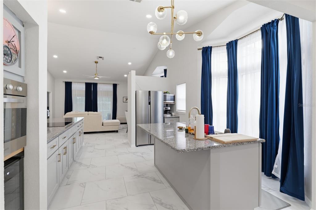 9376 French Quarters Circle Weeki Wachee, FL 34613 - Photo 39 of 43 a living room with furniture and a large window