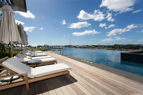 a view of a patio with a table and chairs and couches
