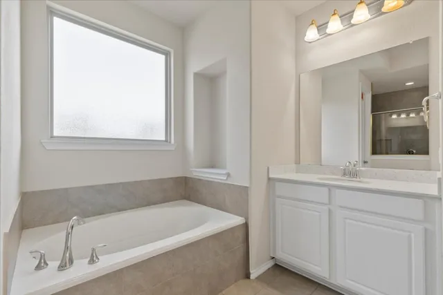 a bathroom with a bathtub and a sink