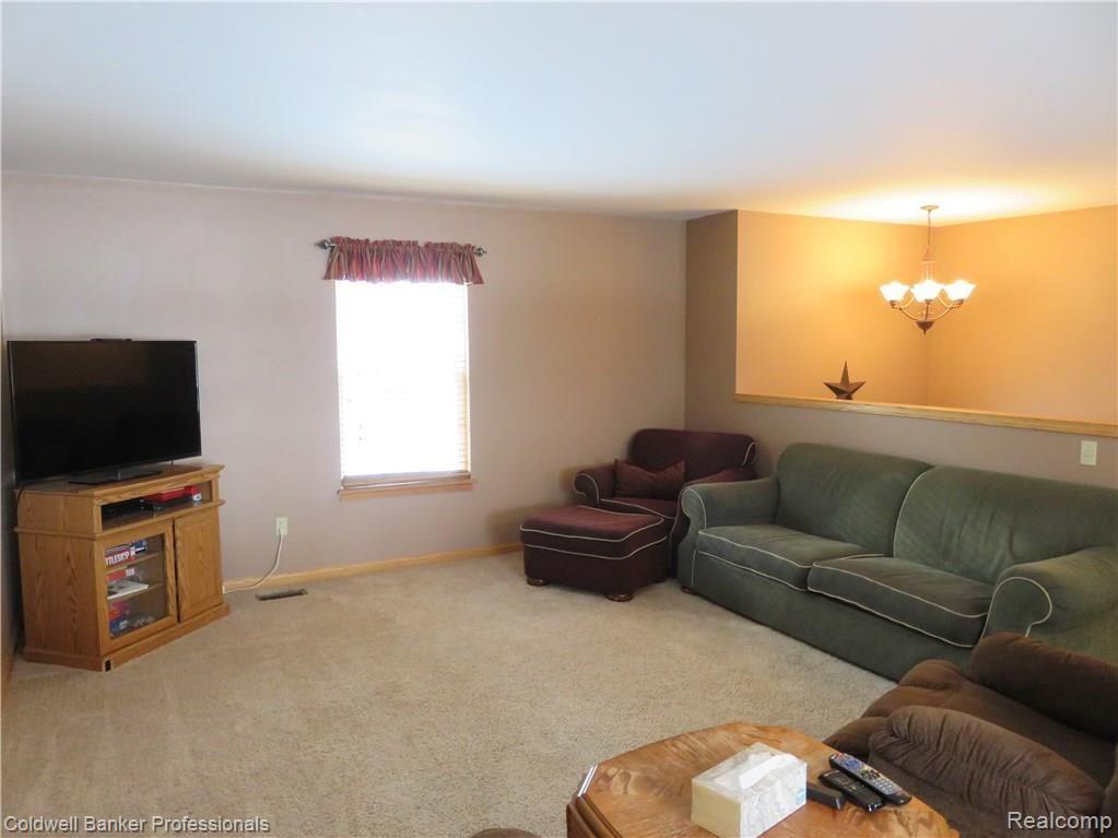 9389 South Cork Road Morrice, MI 48857 - Photo 8 of 16 10 9389 Living Room (1).jpg