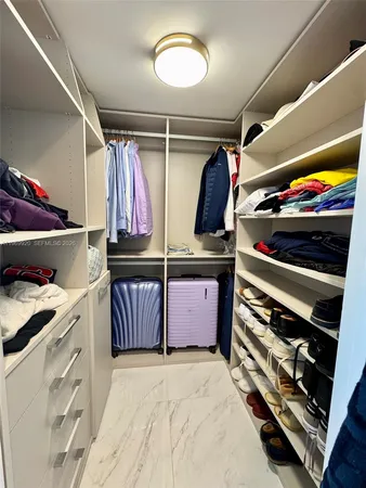 a spacious bathroom with a tub and a shower